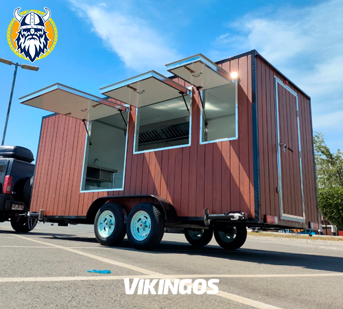 Carro de 2 por 5 metros con revestimiento en siding y con sus ventanas abiertas